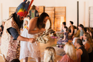 A shaman and his students offer tobacco clearings at a plant medicine ceremony in Boise, Idaho