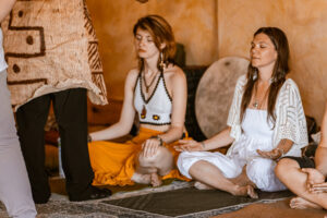 Ceremony participants sit in meditation after receiving tobacco medicine